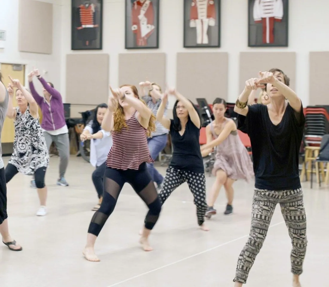 A group of ladies practising dance movements