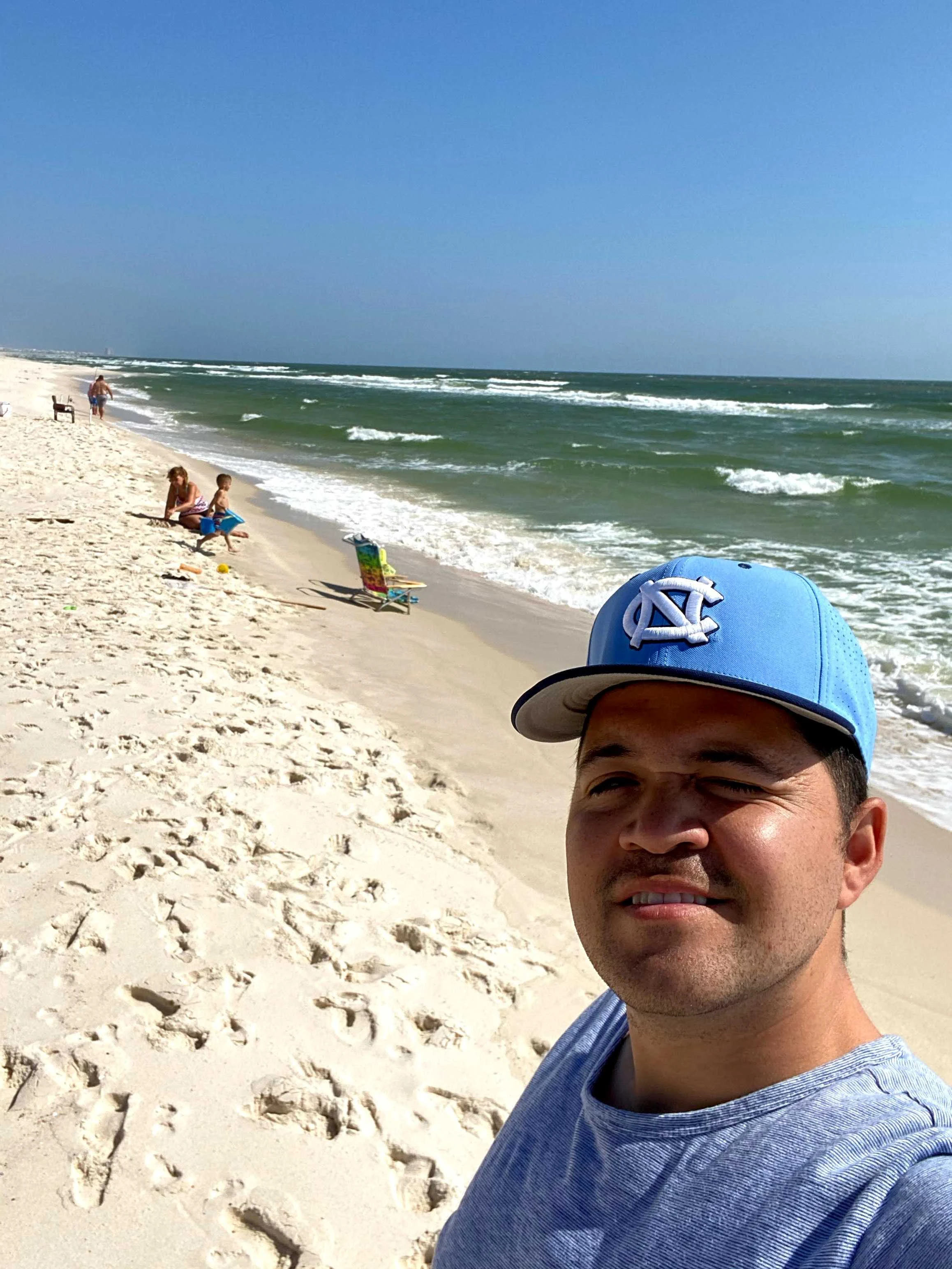 Dr. Cristian Clavijo on a beach