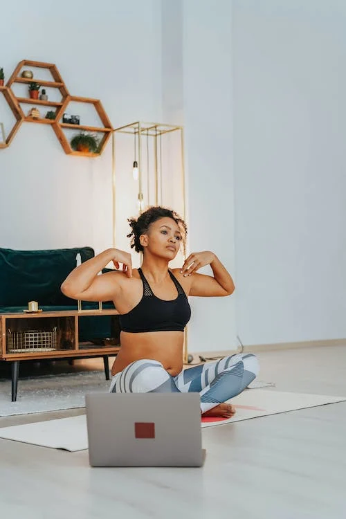 A woman in activewear doing yoga